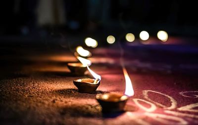 Close-up of lit tea light candles