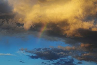 Low angle view of rainbow in sky