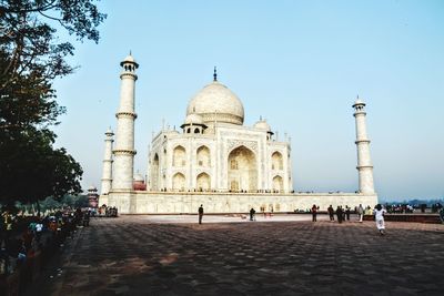 Group of people in front of historical building