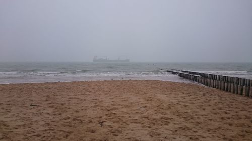 Scenic view of beach against clear sky