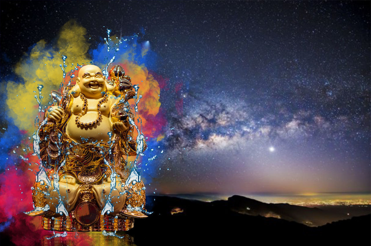 STATUE OF BUDDHA AGAINST SKY AT NIGHT DURING FESTIVAL