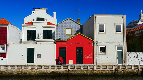 Red house against blue sky