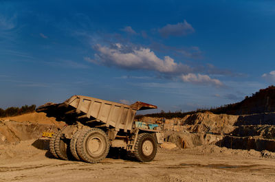 Tractor on field against sky