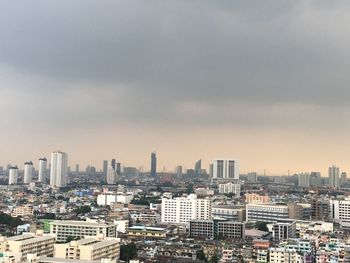 High angle view of buildings in city against sky