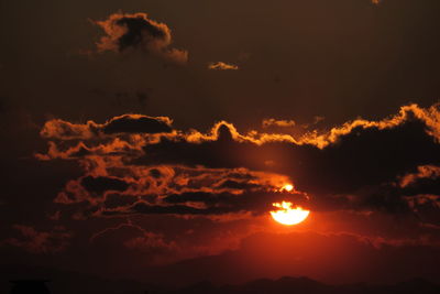 Low angle view of dramatic sky during sunset