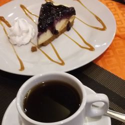 High angle view of coffee served on table