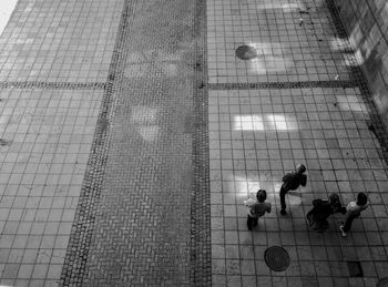 Low angle view of people relaxing on swimming pool