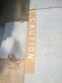 High angle view of text on road