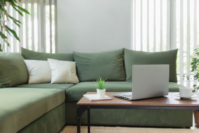 Table and chairs on sofa at home