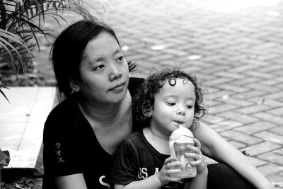 Mother and child take a break from playing