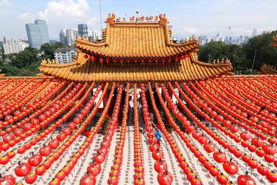 Red roof and lanterns against sky