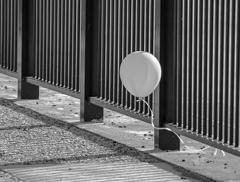 Information sign on railing by street in city