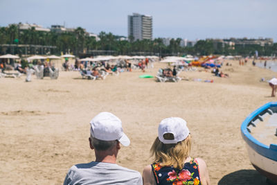 Rear view of people at beach