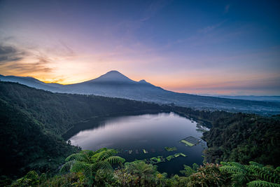 Scenic view of mountains against sky during sunset