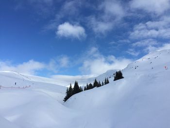 Low angle view of snowcapped mountain against sky