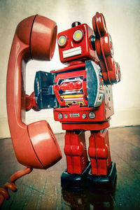 Close-up of red toy car on table