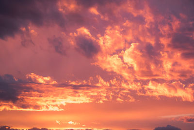 Scenic view of dramatic sky over sea during sunset