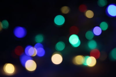 Defocused image of illuminated lights at night