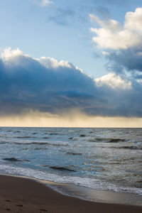 Scenic view of sea against cloudy sky