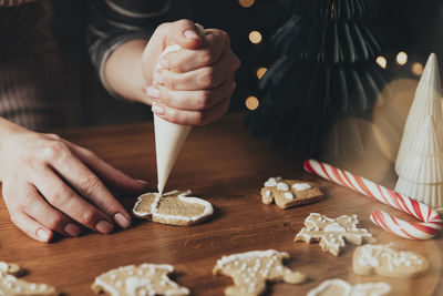 Christmas, new year food preparation. xmas gingerbread cooking, making and decorating fresh cookies