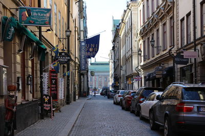 View of street in city against sky