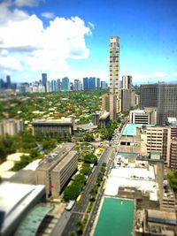 View of cityscape against blue sky
