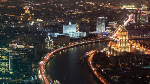 High angle view of illuminated buildings in city at night