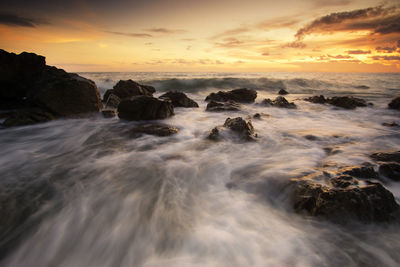 Scenic view of sea against sky during sunset