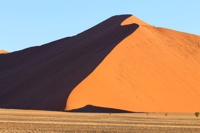 Scenic view of desert against clear sky