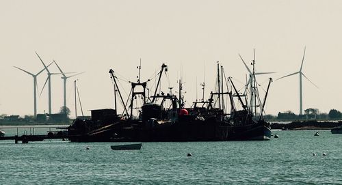 Boats moored at harbor