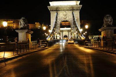 Illuminated suspension bridge at night