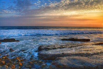 Scenic view of sea against sky during sunset