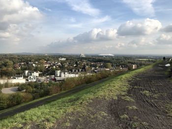 Aerial view of townscape against sky in city