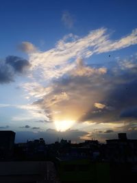 Silhouette buildings against sky during sunset