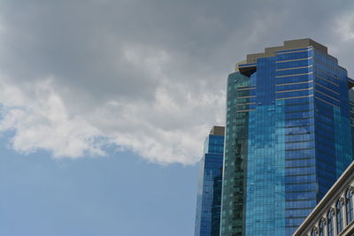 Low angle view of skyscraper against sky