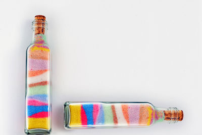 Close-up of multi colored pencils against white background