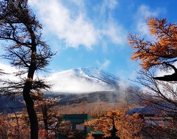 Scenic view of snowcapped mountains against sky during winter