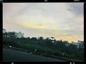 Road against cloudy sky at sunset