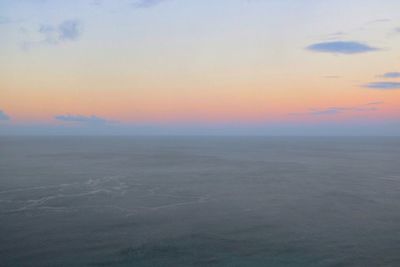 Scenic view of sea against sky at sunset