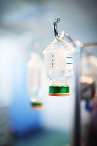 Close-up of glass bottle hanging