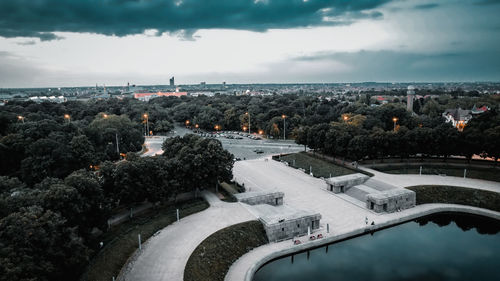 High angle view of buildings and sea against sky