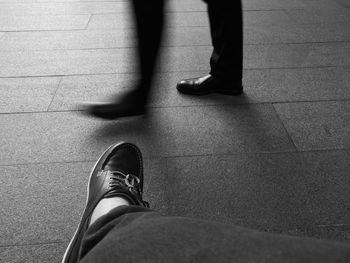 Low section of man standing on floor