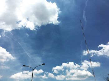 Low angle view of birds flying against sky