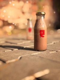 Close-up of glass bottle on table