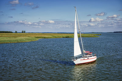 Boat in sea against sky