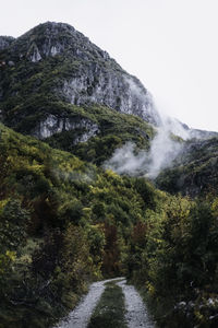 Scenic view of waterfall against sky