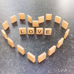 High angle view of love text on wooden blocks