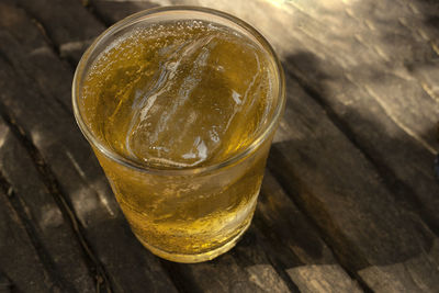 High angle view of beer in glass on table