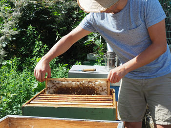 Midsection of man working at farm