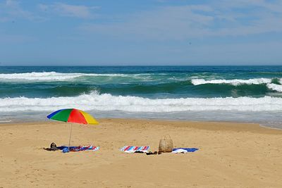 Scenic view of beach against sky